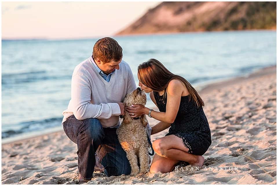 Engagement photos on sand dunes overlooking lake michigan