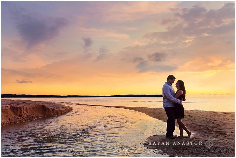 Engagement photos on sand dunes overlooking lake michigan