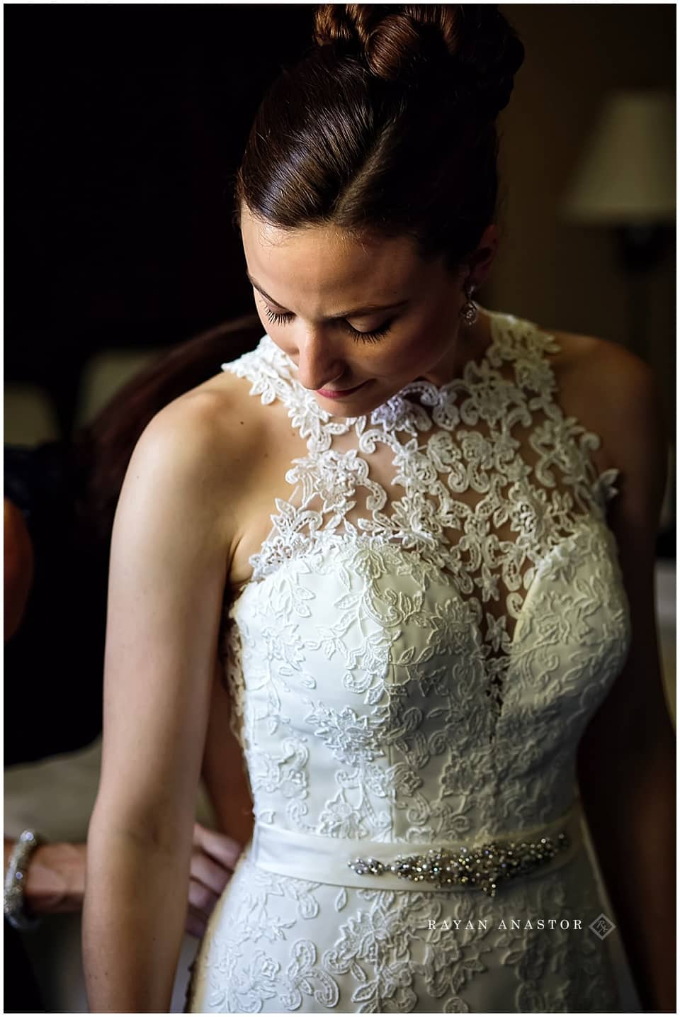 Bride getting dressed at Inn at Stonecliffe