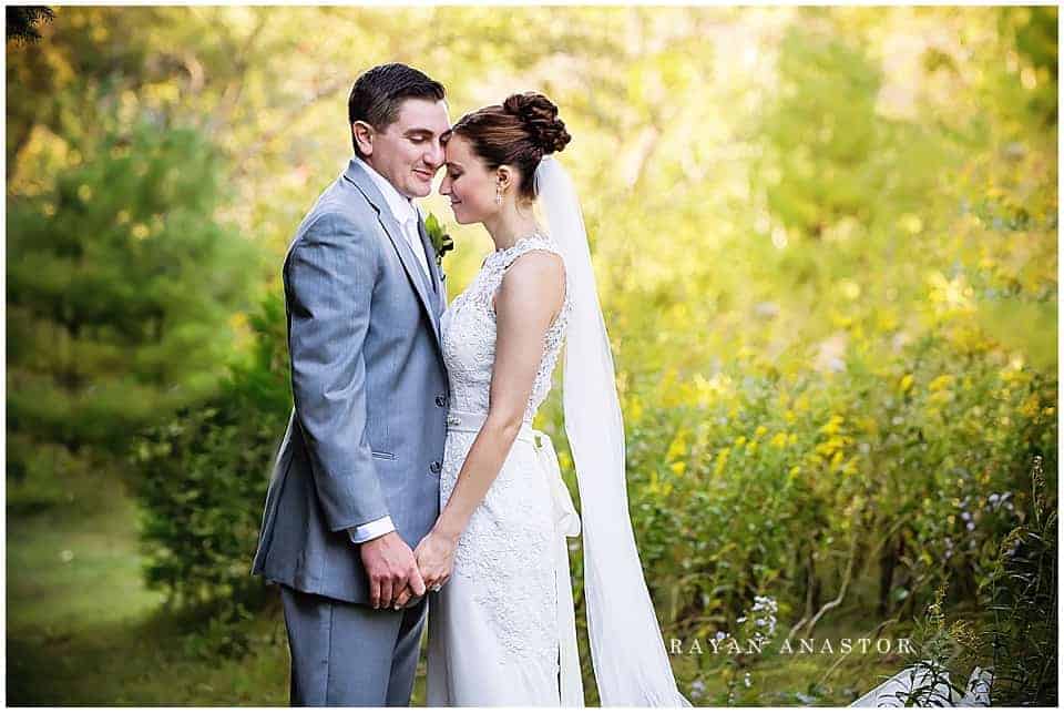 bride and groom portraits in the orchard at the inn at stonecliffe