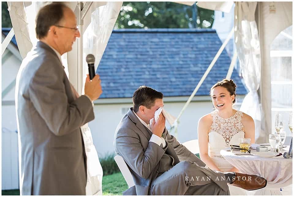father of the bride toasting couple at wedding