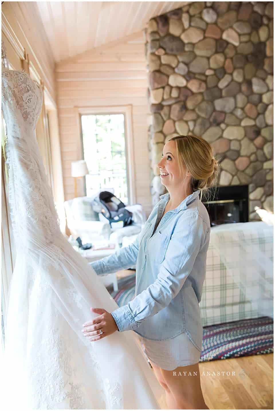 bride getting excited seeing her dress