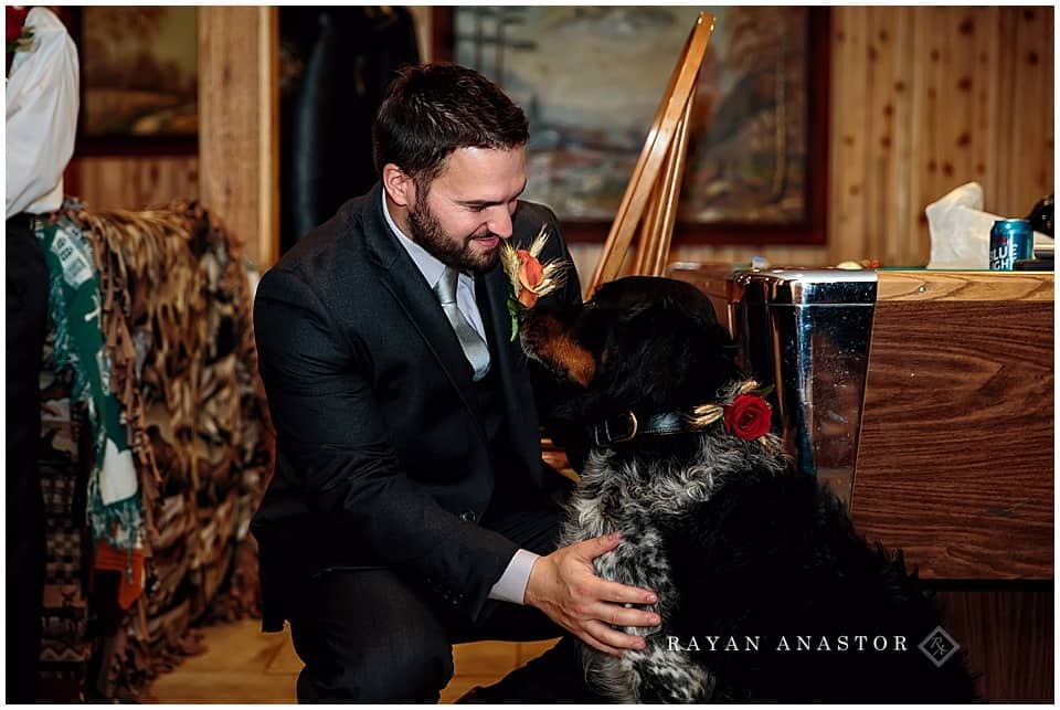 groom getting his dog ready for the wedding