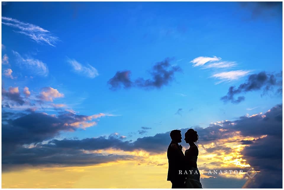 bride and groom with sunset after wedding