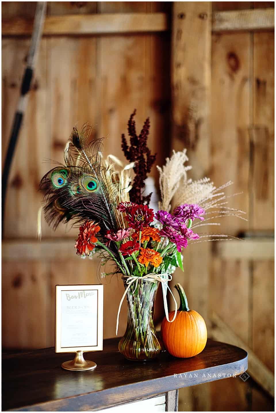 farm fall wedding decorations with pumpkins and fall flowers