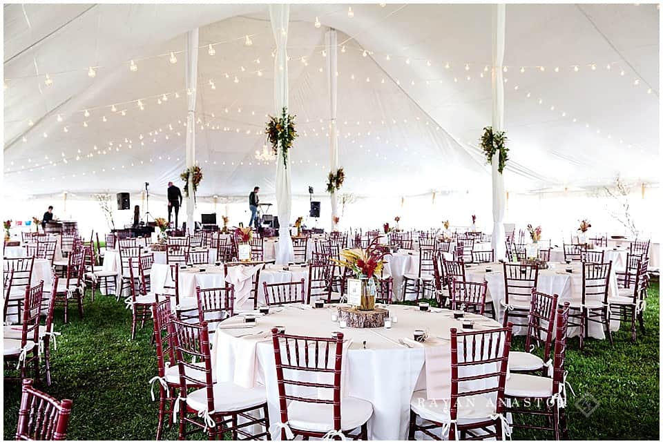 tent wedding reception at private residence with string lights