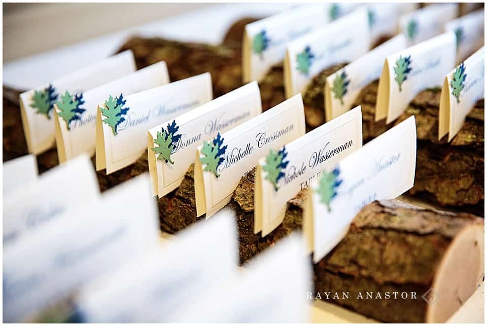 seating cards in wood logs with metal leaves
