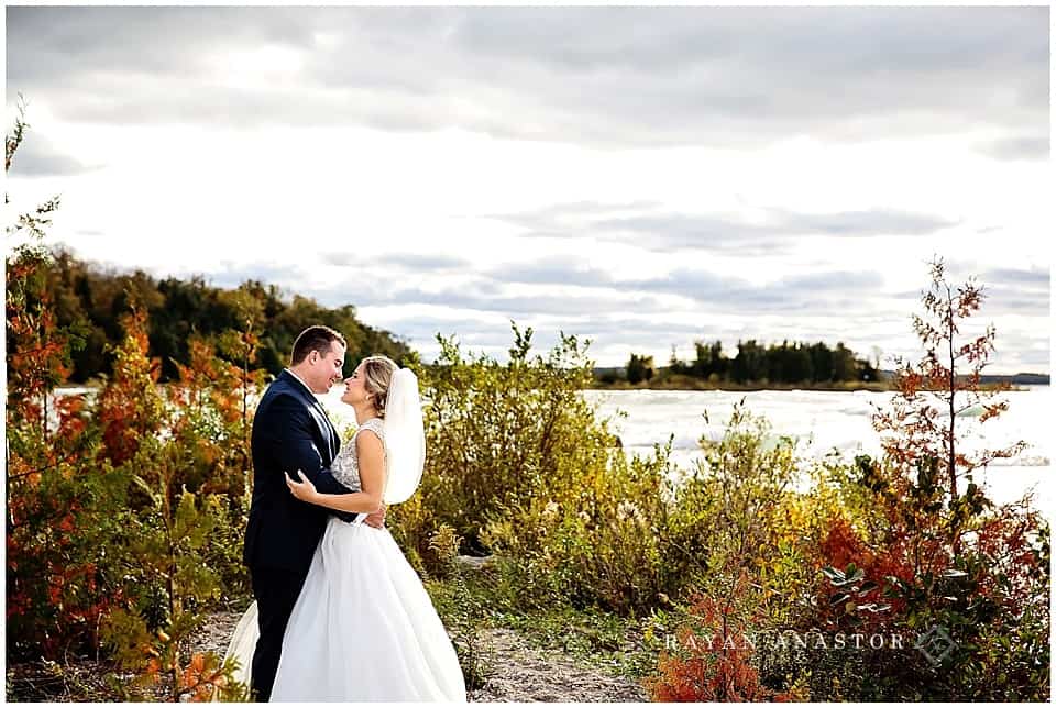 bride and groom on lake michigan at Leelanau State Park
