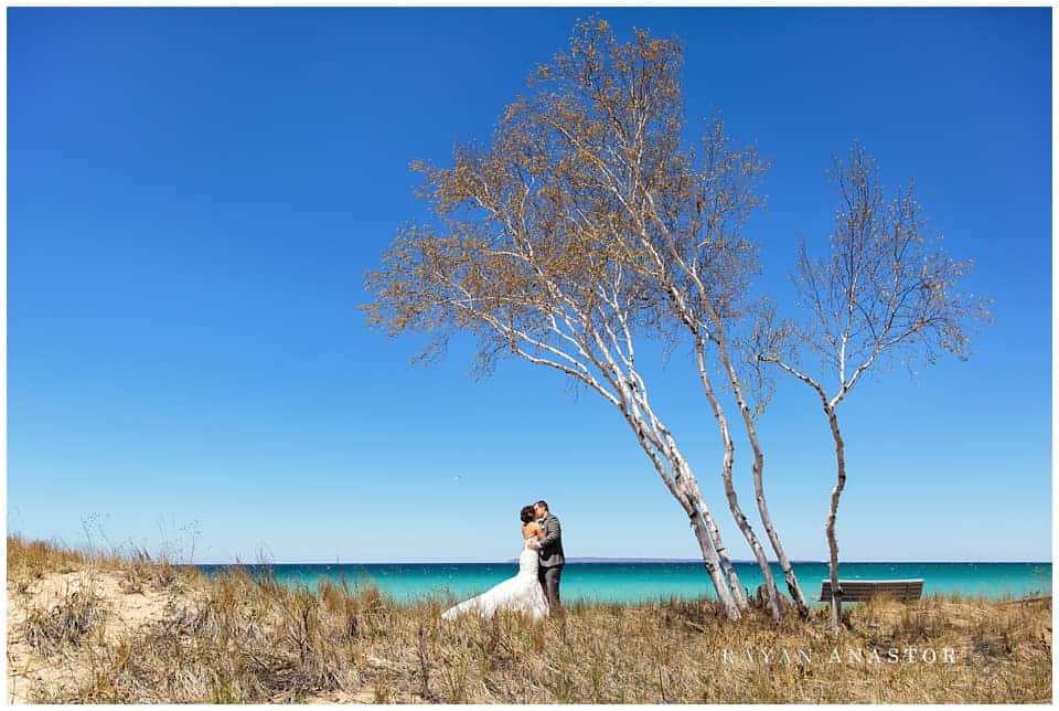 Bride and Groom overlooking the blue waters of Lake Michigan