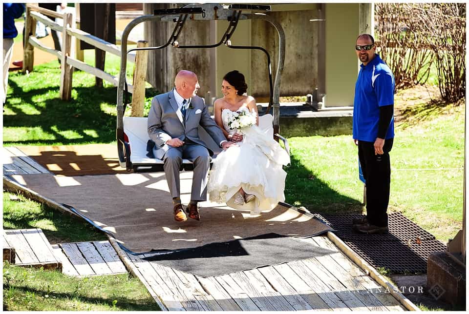 bride riding the chair lift to her wedding