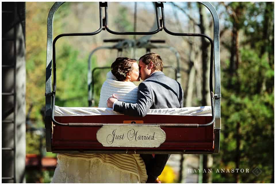 riding the chair lift down after their wedding