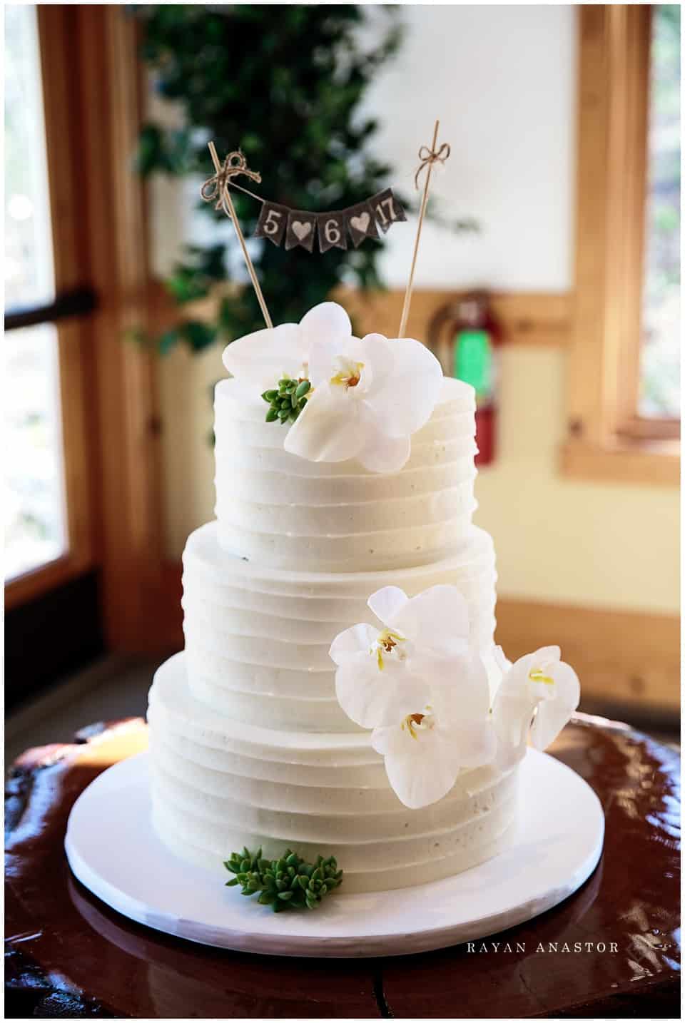 Aunt B's cakes and dessert wedding cake with an orchid