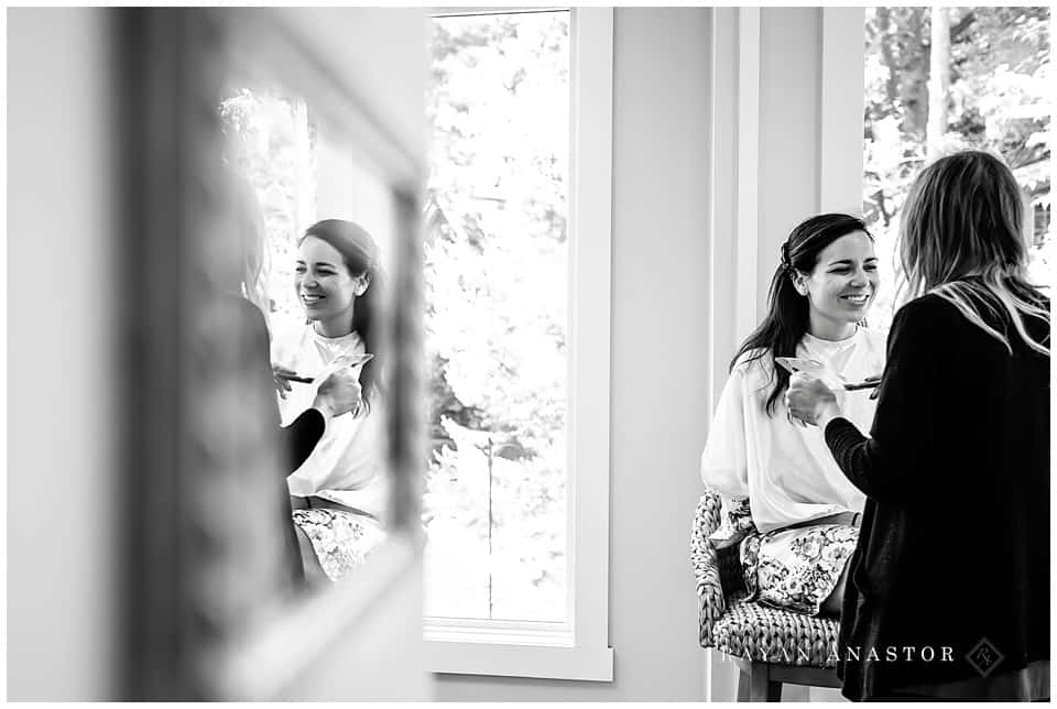 bride getting makeup completed