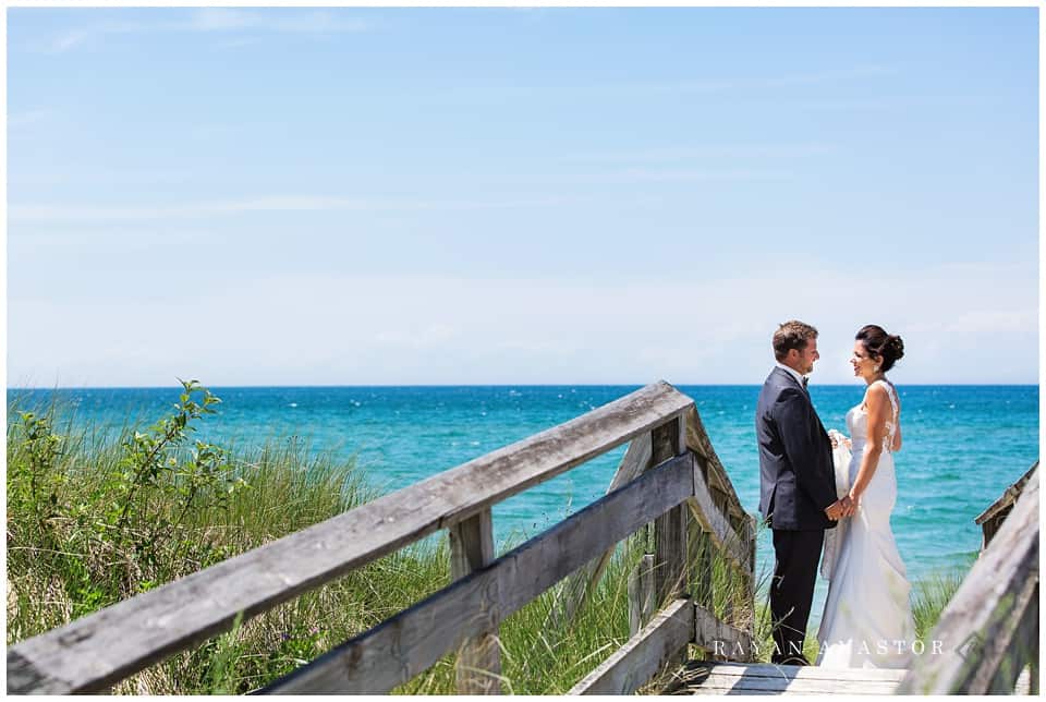 bride and groom overlooking Lake Michigan 