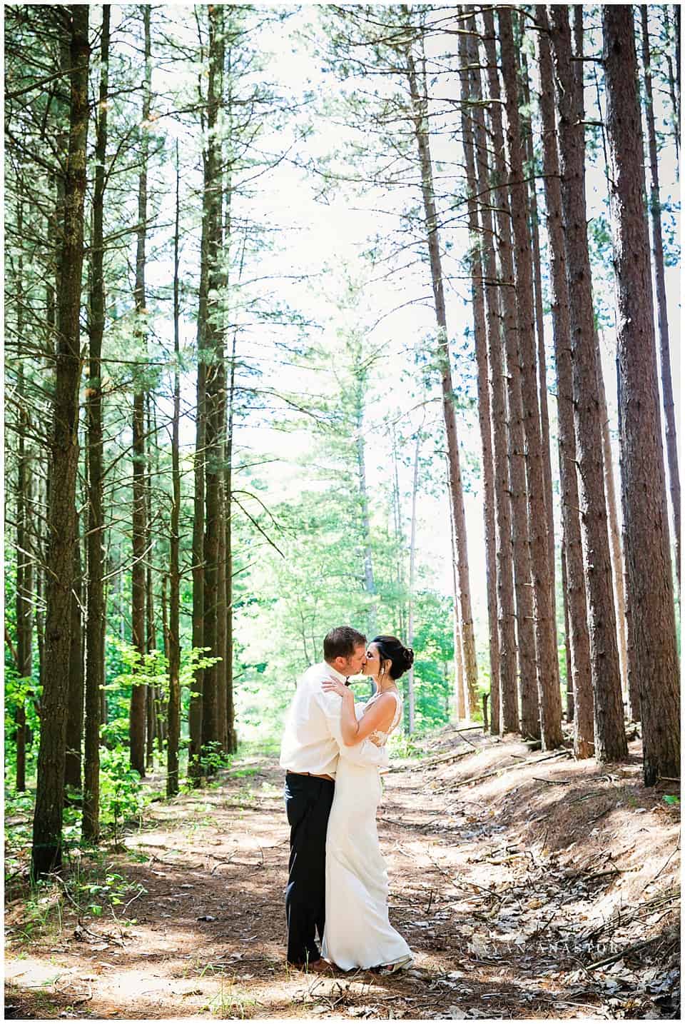 bride and groom in a pine forest