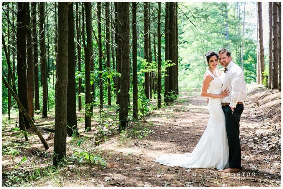 bride and groom in a pine forest