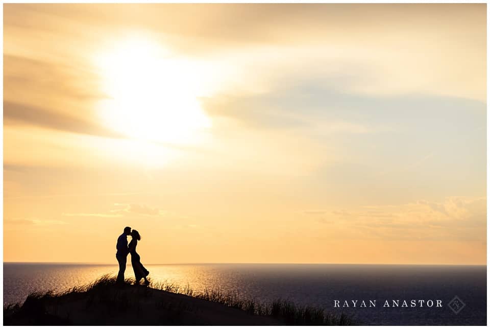 engagement photo on sand dunes at sunset