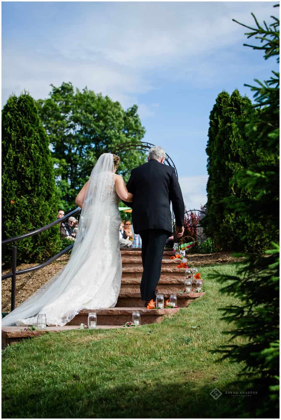 dad walking daughter down the aisle at Aurora Cellars Terrace