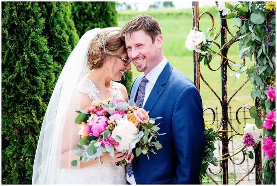 bride and groom with flowers from BLOOM Floral Design