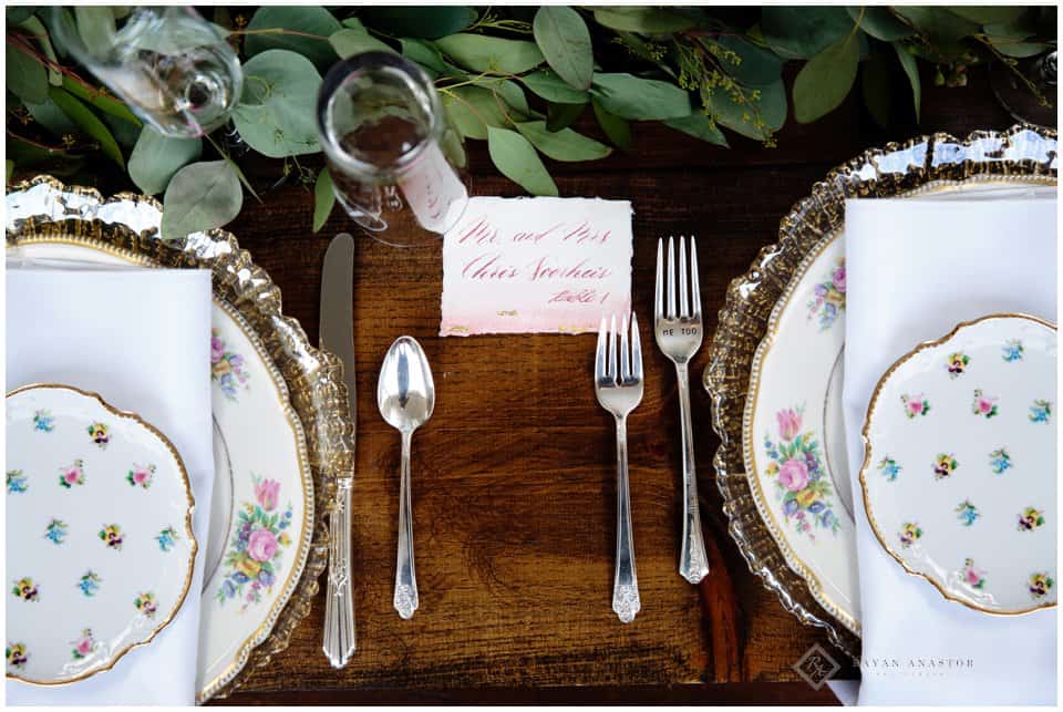vintage china place setting for wedding reception with caligraphy 