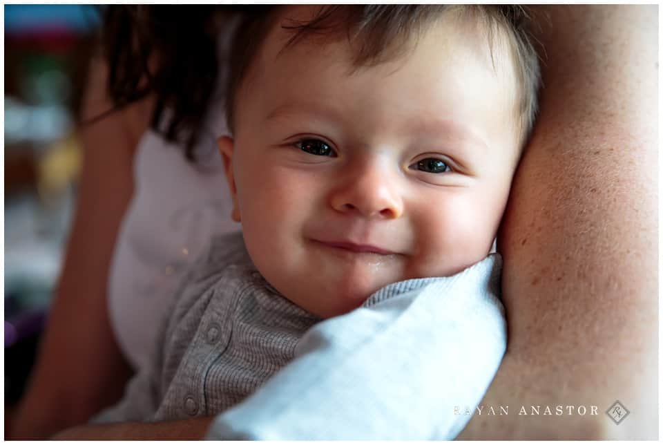 baby nephew smiling at wedding