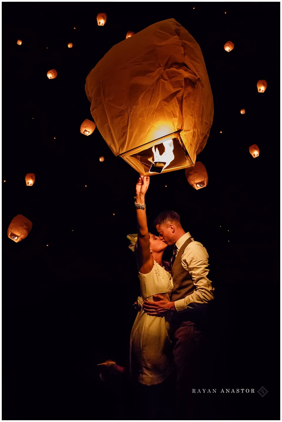 bride and groom releasing chinese lanterns