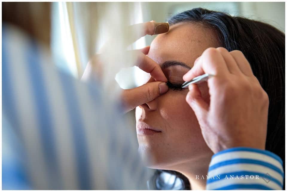 bride having makeup done by blushed beauty