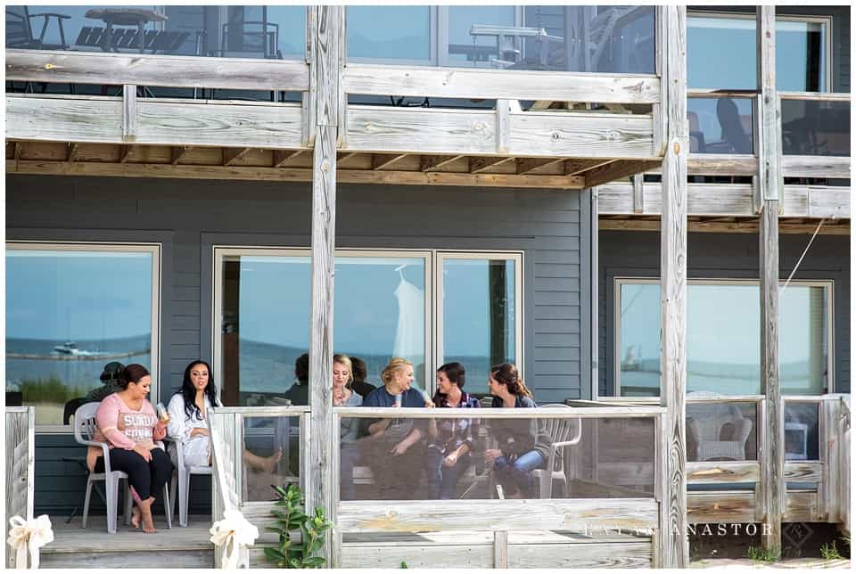 bride and her ladies relaxing on the porch at harbor lights resort