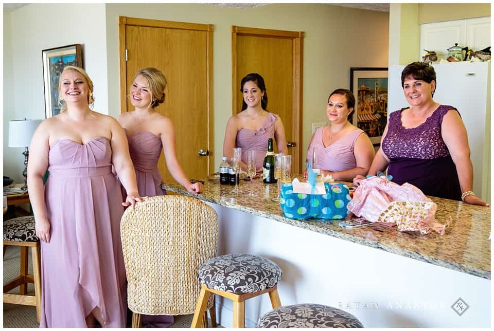 bride getting dressed and ready for beach wedding