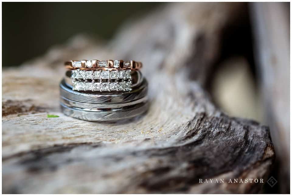 wedding rings on drift wood