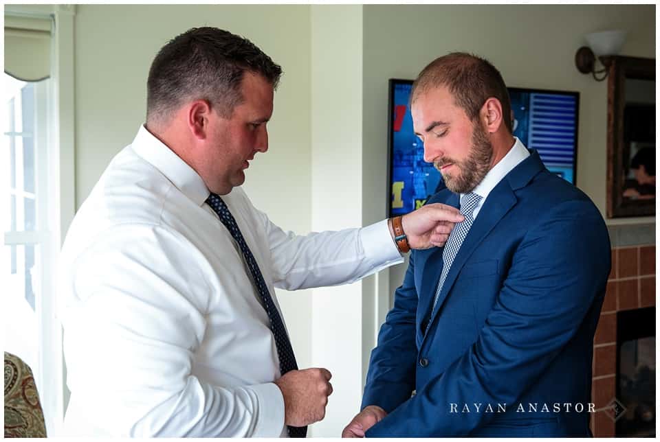groom and best man getting ready