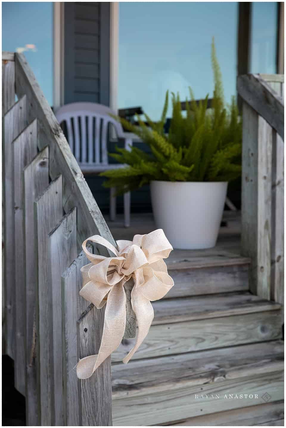 bride getting ready on porch of harbor lights resort