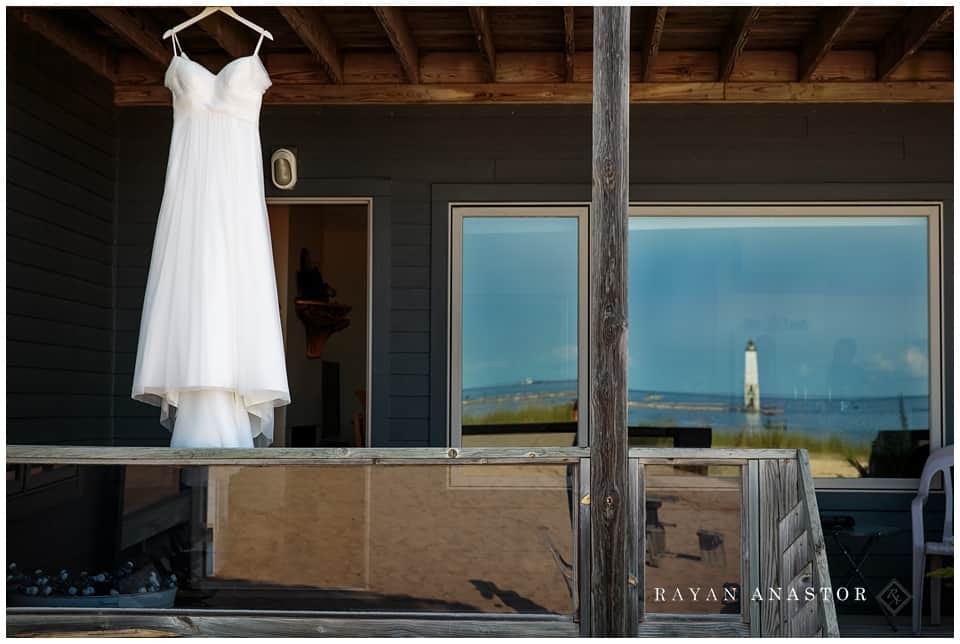 bride getting ready on porch of harbor lights resort