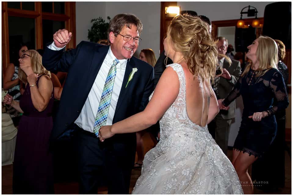 father and his daughter dancing at her wedding reception