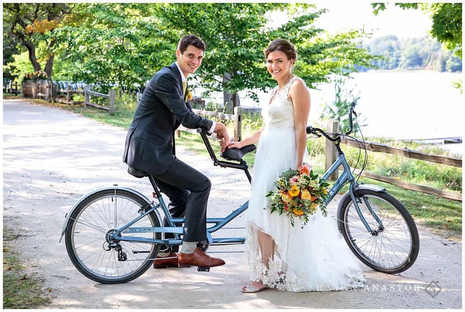 bride and groom on tandem bike