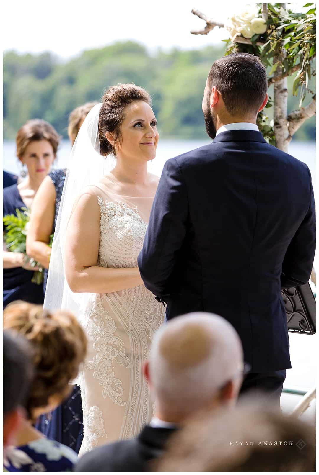 bride smiling at groom on lower herring lake