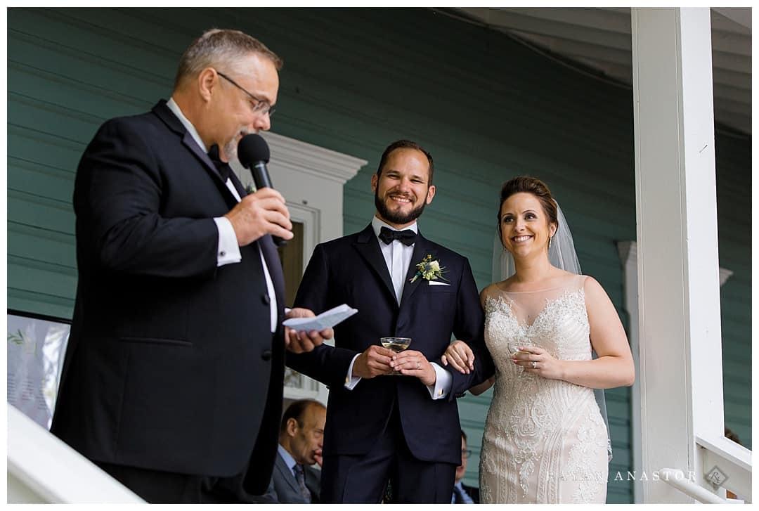 father toasting daughter and her husband at wedding