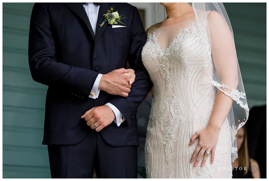 couple holding hands during toasts