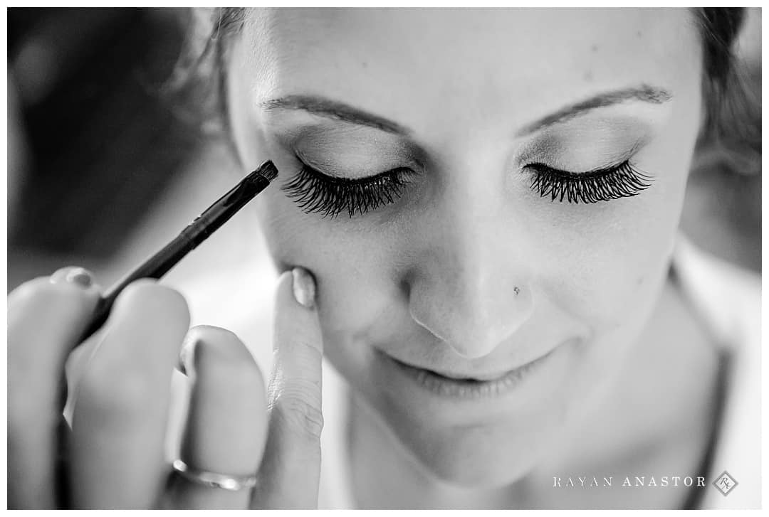 bride having eyeliner applied