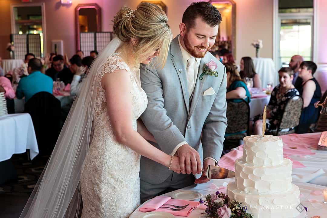cutting cake at wedding