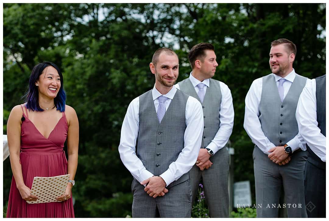 groom excited to see bride walk down the aisle