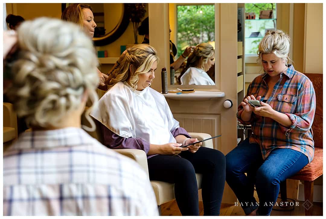 ladies having hair done for wedding at salon