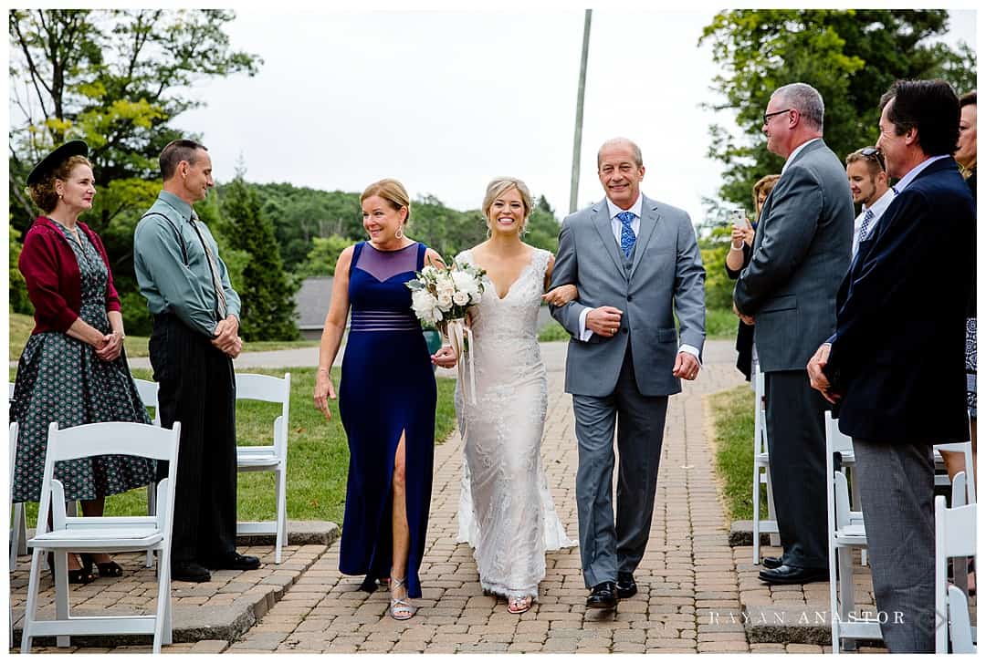 bride walking down aisle on ski hill