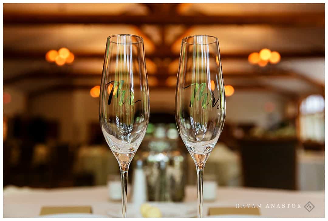 bride and groom toasting glasses