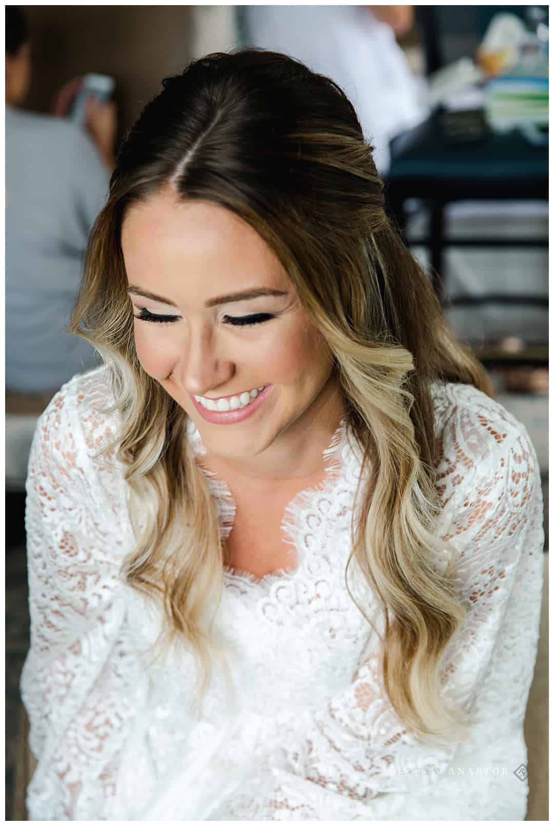 beautiful bridal hair and makeup with lace robe