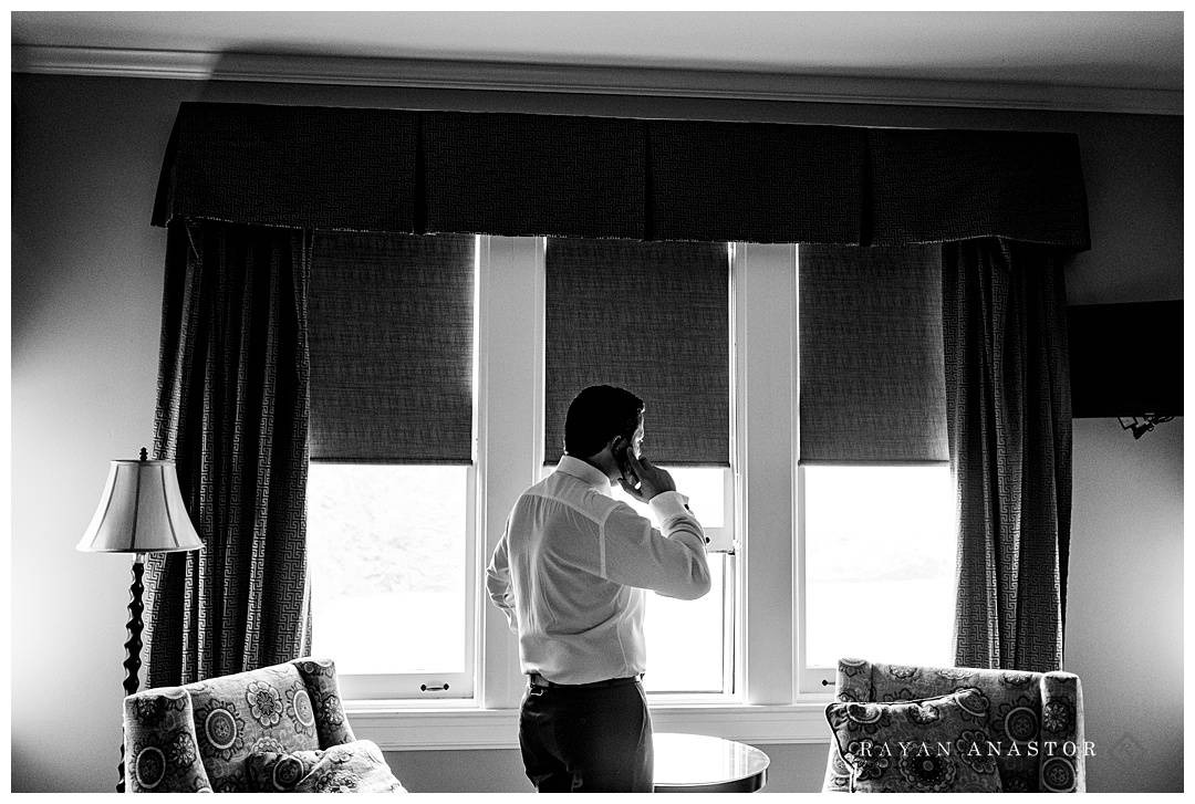 groom on phone before wedding