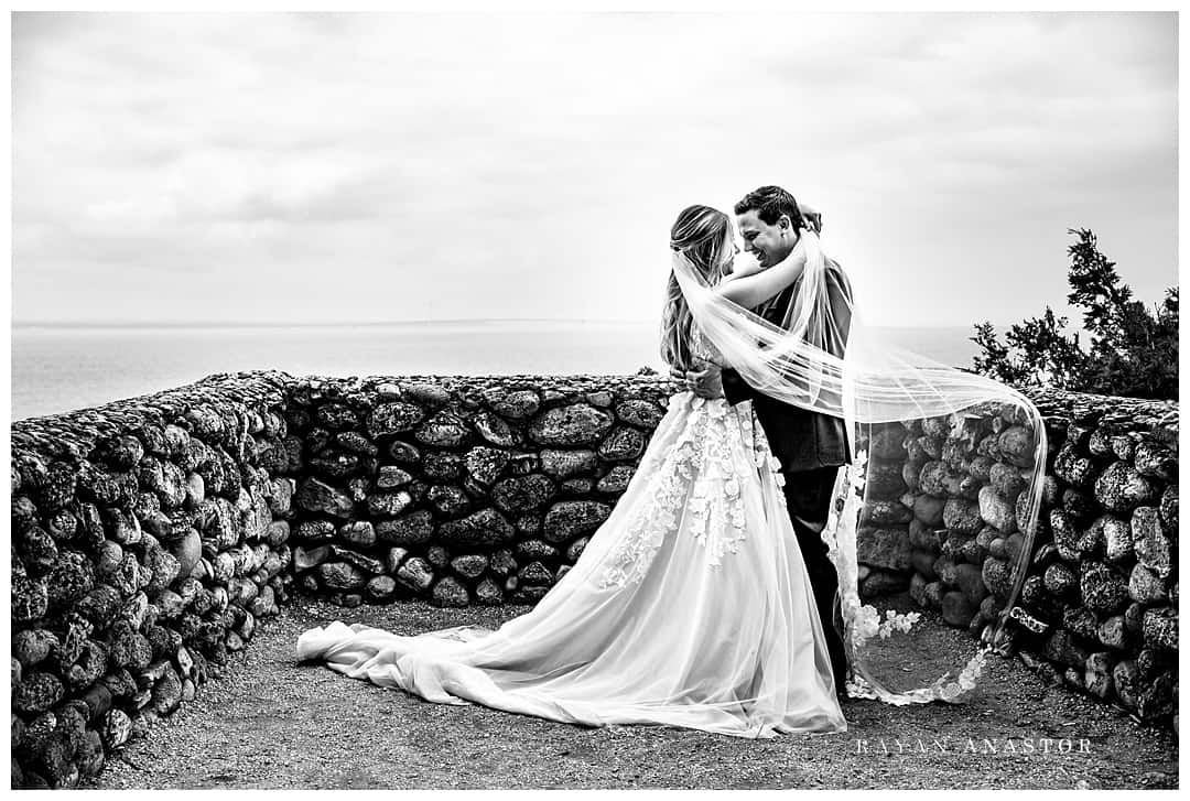 bride and groom with flowing veil on Mackinac island