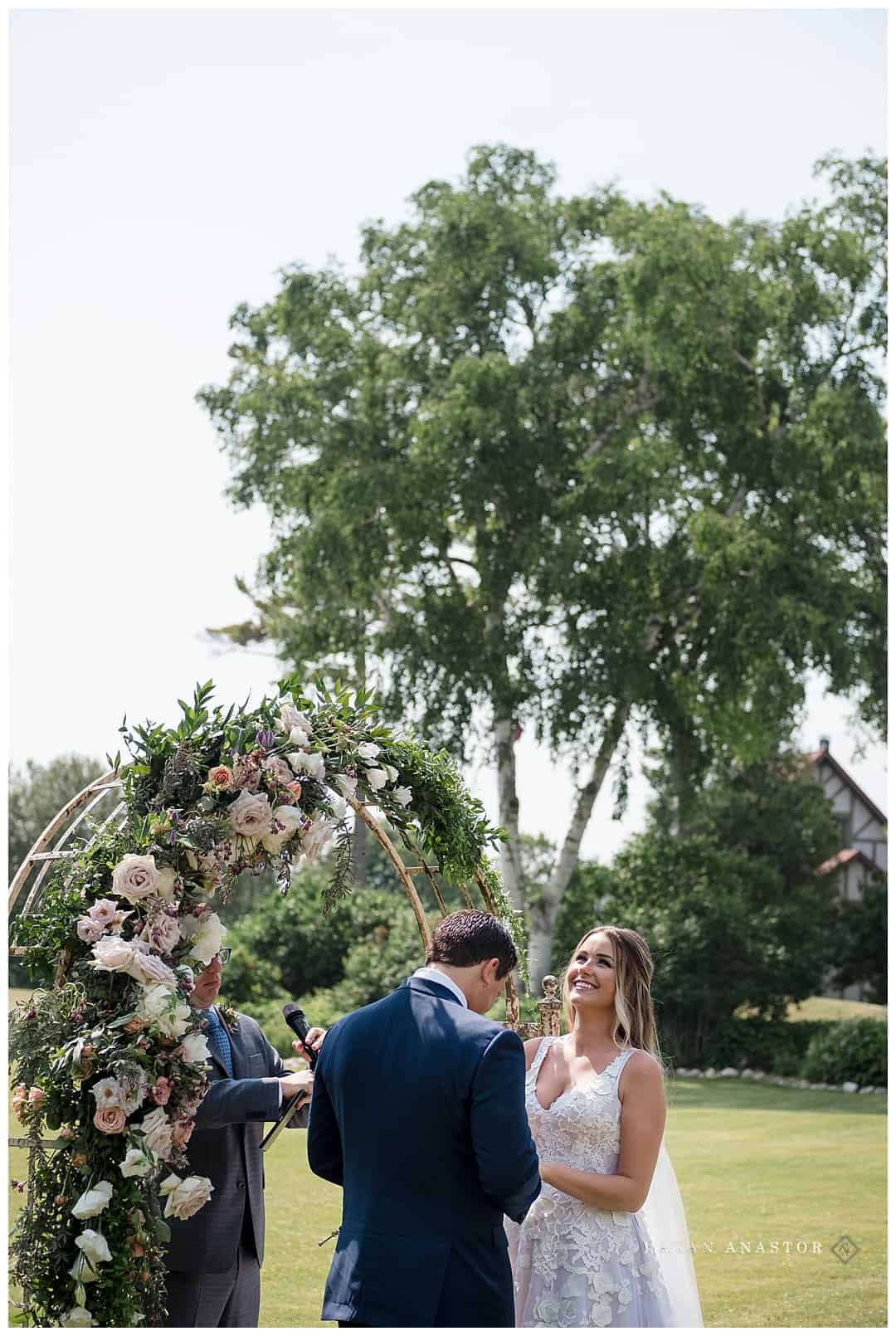 outdoor wedding with floral arch