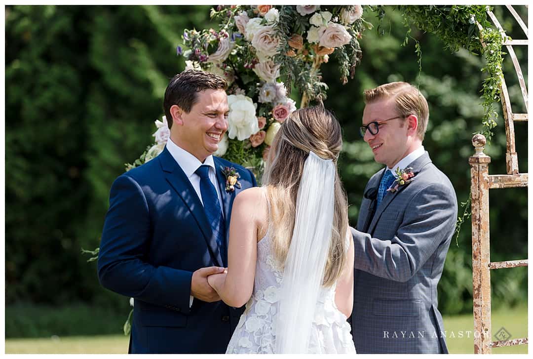 outdoor wedding with floral arch