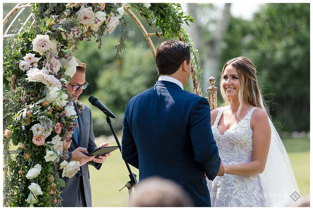 outdoor wedding with floral arch